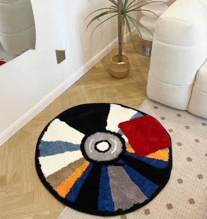 Handmade tufted CD custom rug by Limestoneshop with anti-slip backing, featuring intricate textile details on a neutral background.