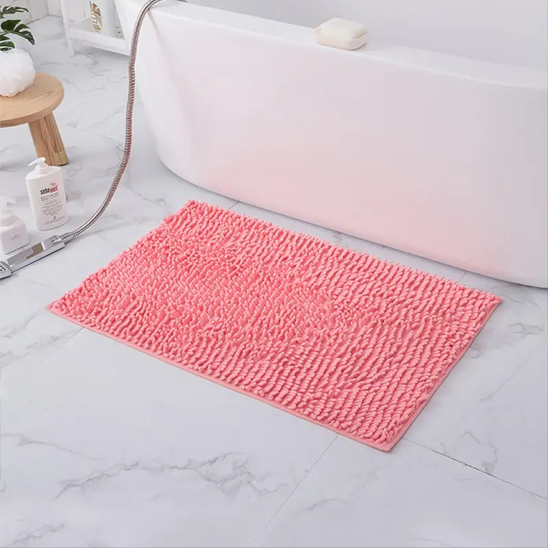 Soft pink chenille non-slip bath rug from Limestoneshop, featuring plush texture and non-slip backing for safe bathroom decor.